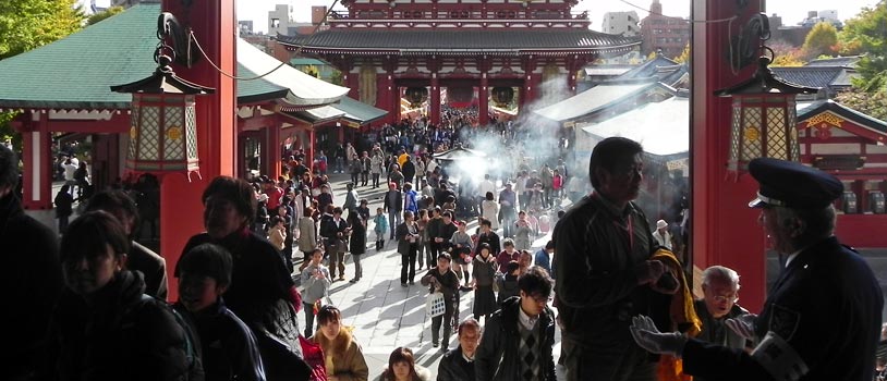 visitors seen from the main hall of the Sensoji temple